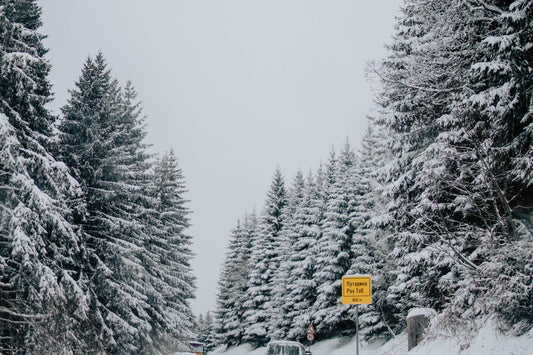 Car driving on a snowy winter road in Canada