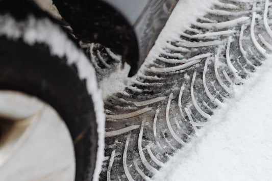 Cooper winter tire tread in snow on a Quebec road