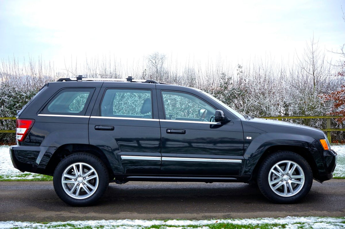 Black SUV parked on a road, illustrating how to choose tires for an SUV in Ontario