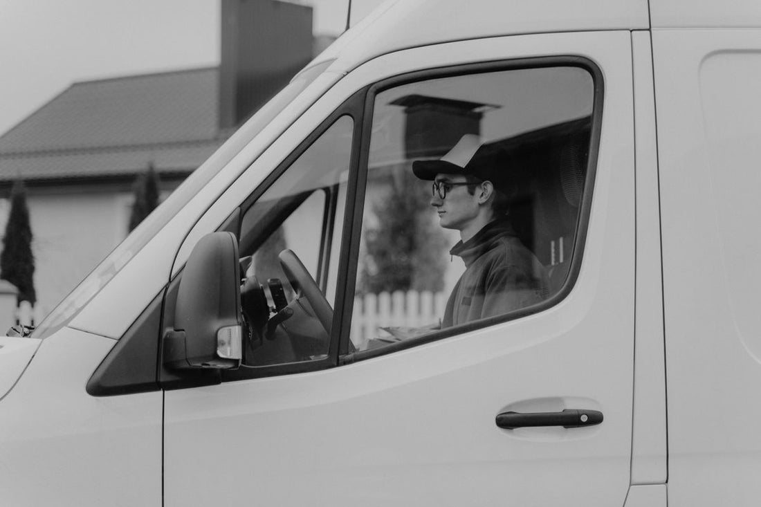 Delivery van driver representing fast online tire delivery to Toronto doorsteps